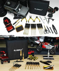 RC Tool Kit With Stand And 26 Piece Repair Set For One Eighth To One Eighteen Scale Cars And Trucks on table with vehicles and tools