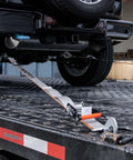 Complete Axle Strap Tie Down Kit With Snap Hook Ratchet Straps Silver Series Webbing securing vehicle on trailer
