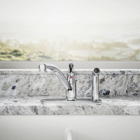 Jolt Swing Spout With Integrated Side Spray faucet in chrome, mounted on marble countertop, bath tap view
