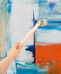 Wood Stain And Paint Brush With Wooden Handle 50Mm Round Head used on a blue and orange abstract painting