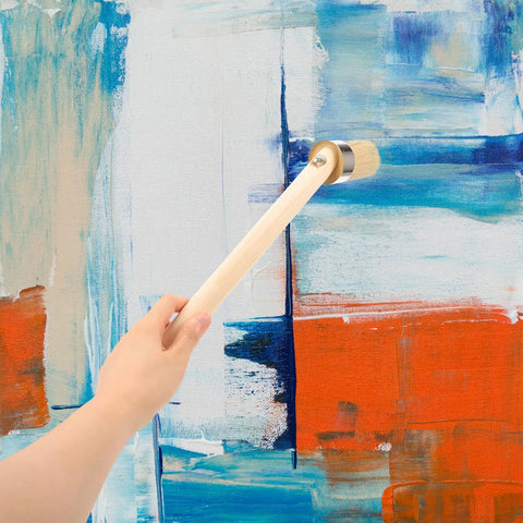 Wood Stain And Paint Brush With Wooden Handle 50Mm Round Head used on a blue and orange abstract painting
