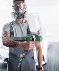 Person using spray gun attached to G1/4 Inch Inlet And Outlet Air Compressor Water Separator With Drain Valve And Pressure Regulator