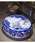 Slick Oval Vessel Sink For Bathroom Vanity Top Notch Premium Porcelain Countertop Wash Basin featuring blue hand painted motifs.