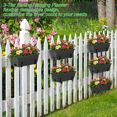 Get Your Garden Game On Point With This Set Of Two Deck Railing Planter Boxes That Clip Over Fence Rails Packed With Six Tough Plastic Flower Pots To Make Growing Herbs Veggies Or Blooms An Absolute Breeze For Chill Weekends And Easy Peasy Garden Vibes. Three-tier black rail planter with flowers on a white fence.