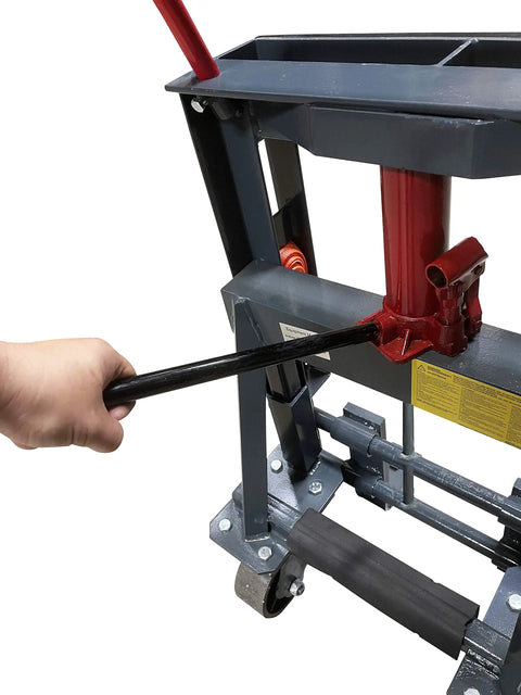 Hand operating hydraulics on Beefy 9900 Lb Capacity Hydraulic Machinery Mover With Adjustable Forks and Swivel Polyurethane Wheels