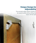 Boss Level Picture Hangers For Drywall And Plaster, Heavy Duty Self Leveling Brackets mounted on a picture frame for easy adjustability.