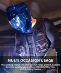 Person wearing Auto Darkening Welding Helmet With Solar Power And Large Viewing Area for TIG MIG ARC Grinding in workshop.