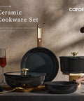15 Piece Ceramic Cookware Set With Detachable Handles, Nonstick Pots and Pans, Black and Gold on a kitchen counter