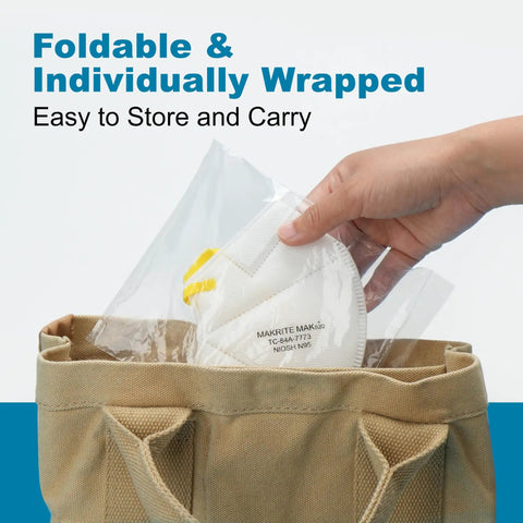 Hand placing foldable NIOSH Approved N95 Respirator Mask 10 Pack With Breathing Valve in a tote bag