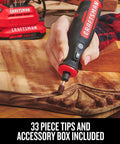 Person using Cordless Rotary Tool With Variable Speed Dial For Precise Finishing From 6,700 To 34,000 RPM on a wood carving