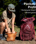 Person securing Ultralight 3L Waterproof Dry Sack Roll Top Closure Lightweight Grab and Go Compact Dry Bag for Camping
