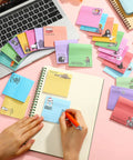 100 Pack Funny Sticky Notes for Work 3 by 3 Inches Sarcastic Self Adhesive Notepads with 25 Designs on desk with laptop and notebook
