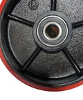 Close-up of 7x2 inch red Poly Tread pallet jack steering wheel with preinstalled bearings and cast iron core