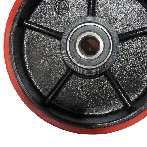 Close-up of 7x2 inch red Poly Tread pallet jack steering wheel with preinstalled bearings and cast iron core