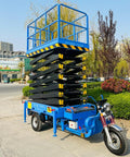 Heavy Duty Electric Hydraulic Scissor Lift Platform With 1000 Kg Capacity Mobile Aerial Work Table, blue, elevated, outdoor setting.