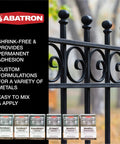 Aluminum-Filled Metal Repair Kit With Epoxy Putty And Structural Adhesive, Gray bottles in front of black metal gate railing.
