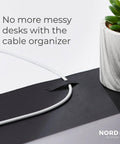Pebble Black Leather Desk Mat With Cable Organizer 35 By 17 Inches, Premium Vegan PU Desk Pad And Mouse Mat close-up with cable