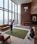 Heavy Duty Golf Practice Net 10x7 Feet with Sturdy Frame set up in a modern high-rise living room for indoor golf training.