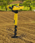 Cordless Post Hole Digger With Battery And Charger Beast Mode Power 350W Earth Auger in action on soil, 30x8 cm drill bit.