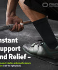 Person lifting weights wearing All Day Ankle Support Sleeve For Men And Women Open Toe Brace For Sprains Swelling Achilles Tendon