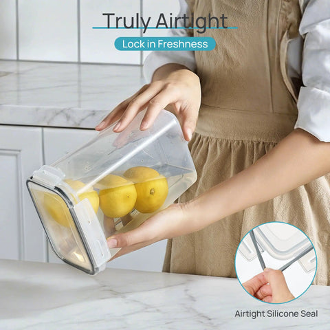 Person holding Stackable Airtight Food Storage Containers With Lids, 24-Piece Plastic Canister Set For Cereal, Dry Food, Flour And Sugar, BPA Free, Includes 24 Labels, Black Kitchen Pantry Organization For A No Mess Kitchen with lemons inside