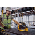 DeWalt 20v Max Cordless Grabo Vacuum Suction Lifter With Built In Pressure Sensor For Heavy Materials Up To 265 Lbs Bare Tool Only in use by worker.