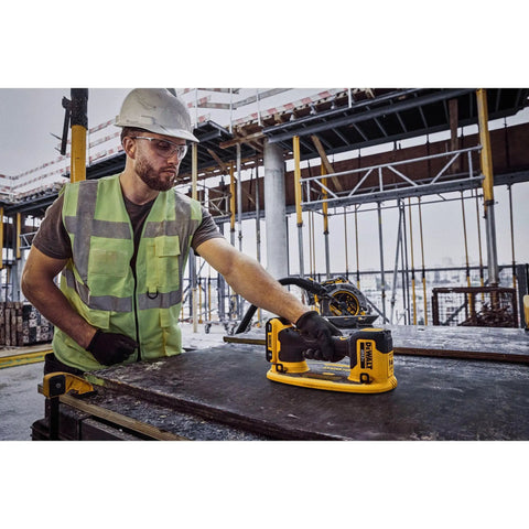 DeWalt 20v Max Cordless Grabo Vacuum Suction Lifter With Built In Pressure Sensor For Heavy Materials Up To 265 Lbs Bare Tool Only in use by worker.