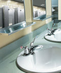 Commercial Two-Handle Centerset Lavatory Faucet With Drain In Chrome Finish, 4-Inch, installed in a high-traffic public bathroom.