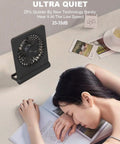 Ultra Quiet 6.8 Inch Desk Fan With Battery And USB Power on desk next to sleeping person, showing quiet operation.
