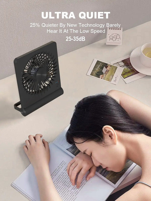 Ultra Quiet 6.8 Inch Desk Fan With Battery And USB Power on desk next to sleeping person, showing quiet operation.