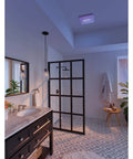Bathroom with SurfaceShield Vital Vio Bathroom Exhaust Fan Grille With Disinfecting Violet Led Light in ceiling, white finish.