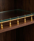 Gold Tone Gallery Rail Brackets With 6mm Hole Metal Spindles for glass shelf on wooden bookcase.
