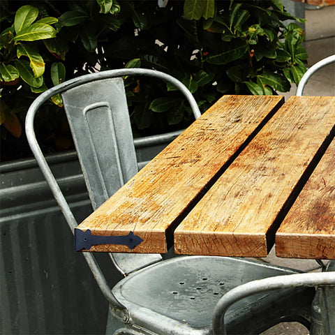 Four Inch Furniture Corner Guards With Black Metal Edge Protectors Right Angle Brackets For Sofas And Tables Rust Resistant Home Hardware Offering Dang Solid Protection And Slick Matte Finish attached to a wooden table.