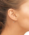 Side view of ear with Two Piece Piercing Taper Set For 20G Flat Back Insertion Tools Stainless Steel Threadless Insertion Pins