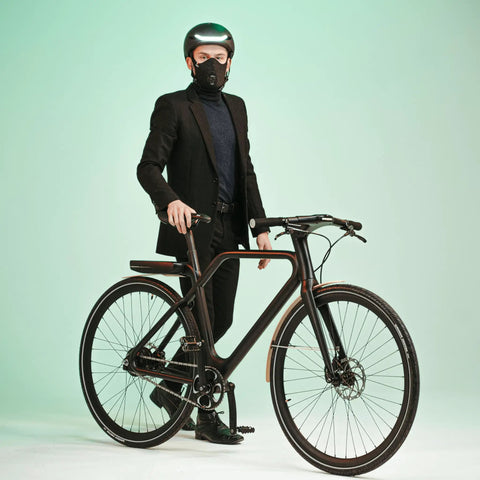 Road Ready Nano Light Hexagon Motorcycle Half Face Mask With Anti Pollution Filter worn by cyclist with bike in studio