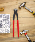 Kick Your Plumbing Game Up With This Heavy Duty Single And Double Ear Hose Clamp Tool Kit Ranging From 6mm To 23.5mm For A Tight Leak Free Grip On Any Pipe Or Hose Job Without The Hassle. with stainless steel clamps and red pliers on a wooden surface