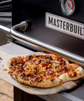 Gravity Series Outdoor Pizza Oven Accessory Insert With Ceramic Stone And Stainless Interior in use baking a pizza