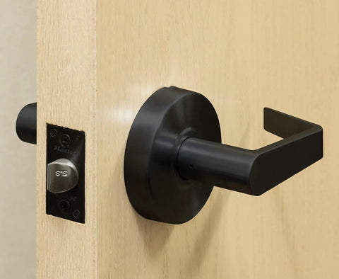 Heavy Duty Lever Style Interior Door Lock Grade Two Commercial Passage Lock With Oil Rubbed Bronze Finish Two And Three Quarters Inch Backset Cylindrical Construction UL Listed For Non Locking Interior Applications Durable Smooth Operation And Reliable installed on wooden door