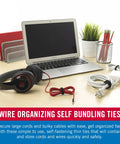 Office desk with laptop, headphones, and power cords secured with self fastening cable ties 100 pack 8 by 0.5 inch black.