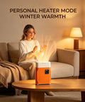 Woman warming hands with All In One Portable Clothes And Shoe Dryer With Hot Air Heater Mini Compact Electric Dryer in living room.