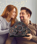 Novabright Vintage Copper Steampunk Gear Train Figurine For Desk Decor held by a smiling couple indoors