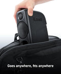 Ultra Compact 50W Wireless Bluetooth Studio Monitors Dual Reference Speakers being placed into a bag, showcasing portability.