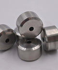 Five stainless steel waterjet nozzle seats with central holes.