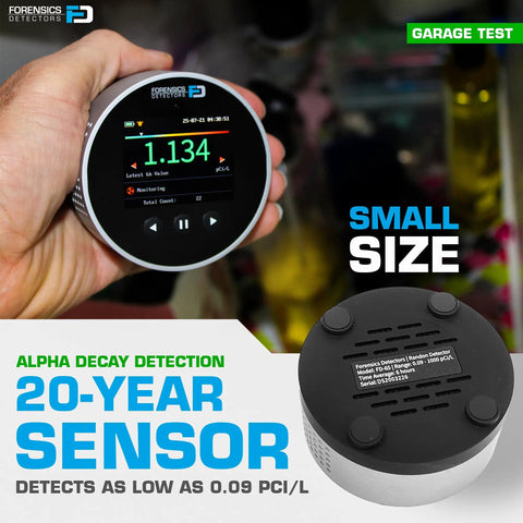 Heavy Hitter Radon Detector For Homeowners Featuring Upgraded Version 2.0 with color LCD display in hand during garage test.