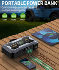 8000A Jump Starter with 160 PSI Air Compressor and 12V Power Bank charging devices on a table with USB ports visible.