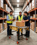 Stainless Steel Expandable Roller Conveyor Packs Hella Tough 900 Pound Load Capacity Adjustable Height in a warehouse with workers.