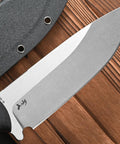 Close-up of Rugged AUS 10 Fixed Blade Knife With Carbon Fiber Handle and sheath on wooden background, showcasing the blade detail.
