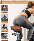 Wide Comfort Bike Saddle For Men And Women With Extra Large Winged Padding, used on stationary bike by woman indoors.