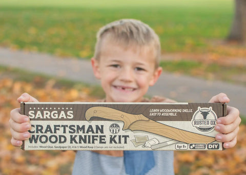 Child holding DIY Wooden Knife Making Kit For Kids Teens And Adults - Real Wood Craft Gift with packaging showing contents