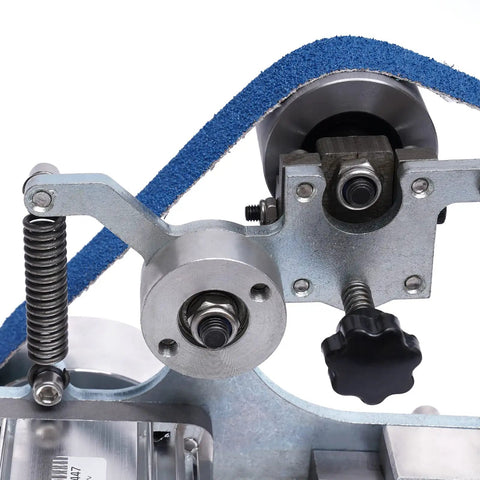 Close-up of the 550W Brushless Desktop Belt Sander With Dang Solid Steel Construction, showing the grinding mechanism.